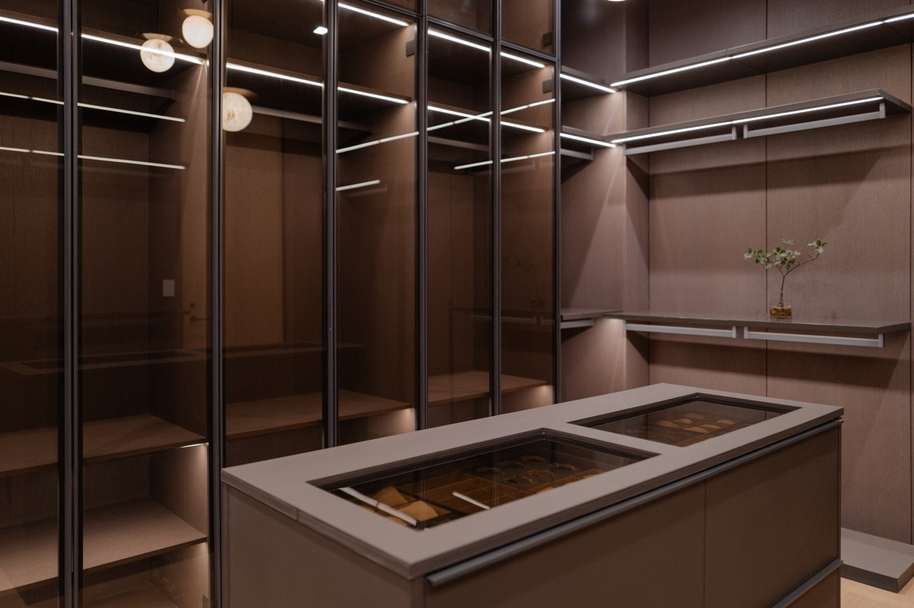 Closet island with glass-topped display drawers for watches and jewellery