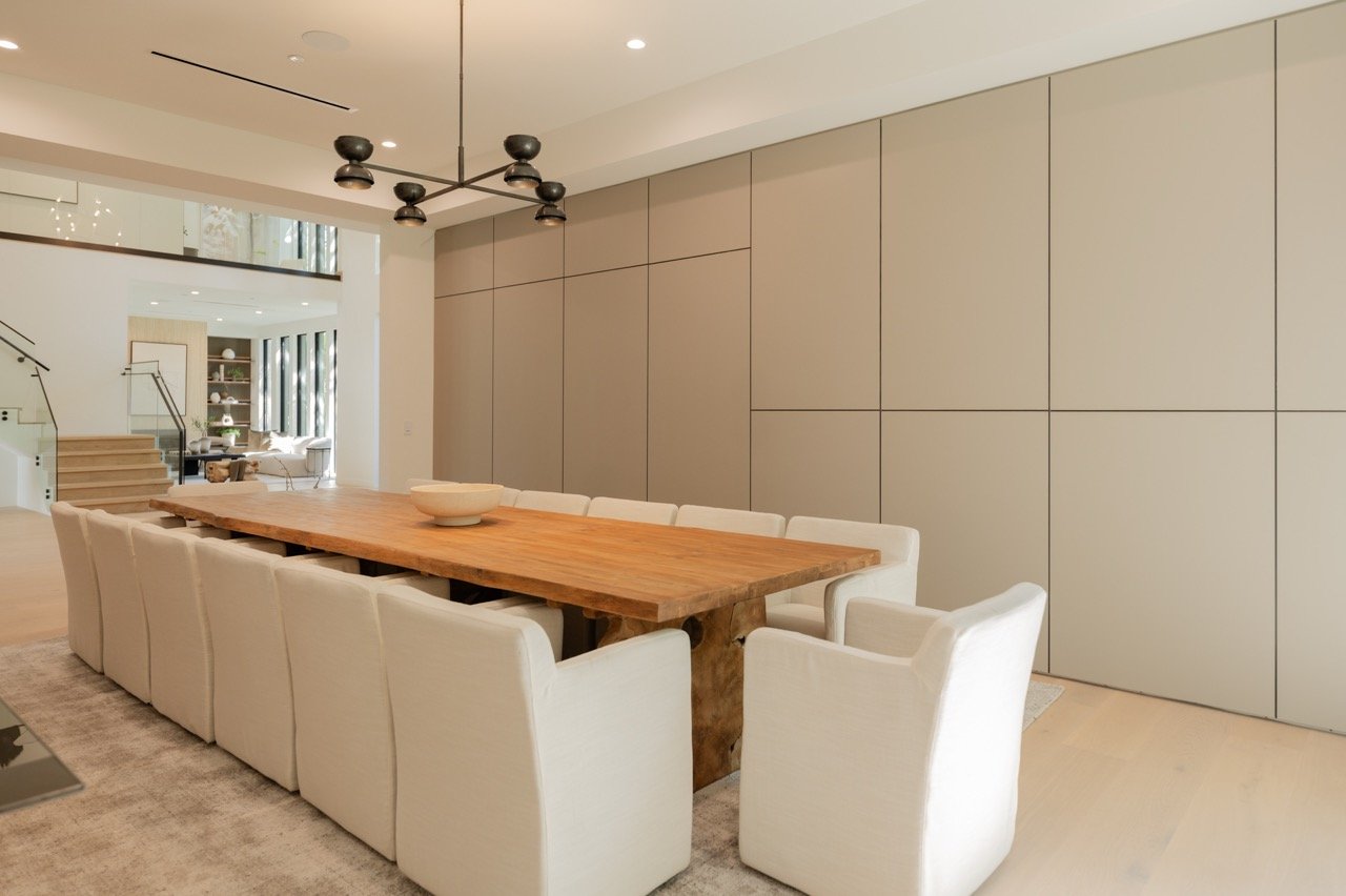 Dining room wall of concealed storage, flush and handleless